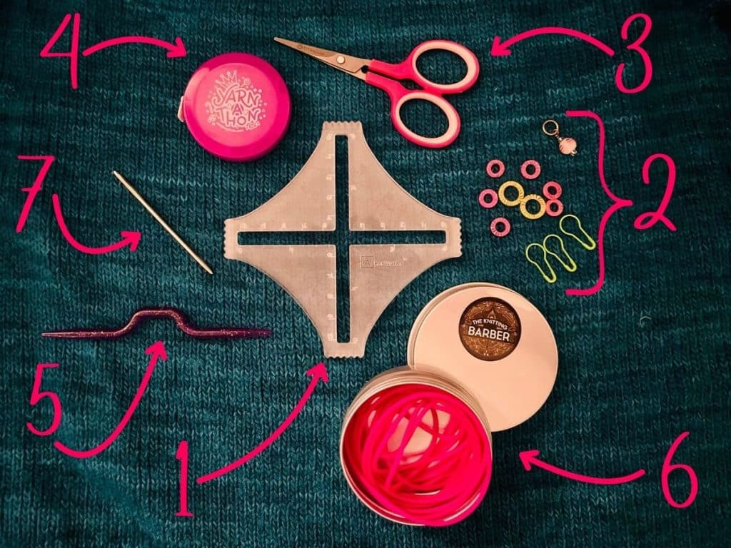 Photo of 7 Ultimate Knitting Notions: Akerworks swatch gauge, stitch markers, scissors, tape measure, cable needle, Knitting Barber Cords, and darning needle