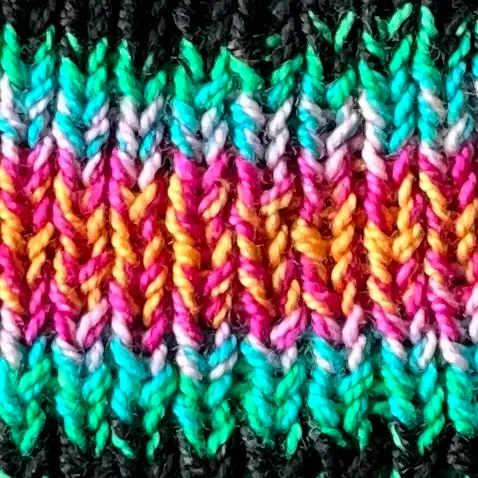Inside and outside ends of one skein of String Theory Colorworks Inertia Self-Striping Yarn